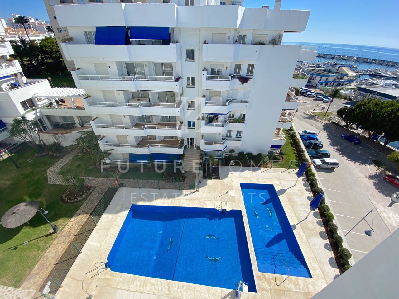 Frontline apartment for sale in popular community overlooking Estepona Marina!