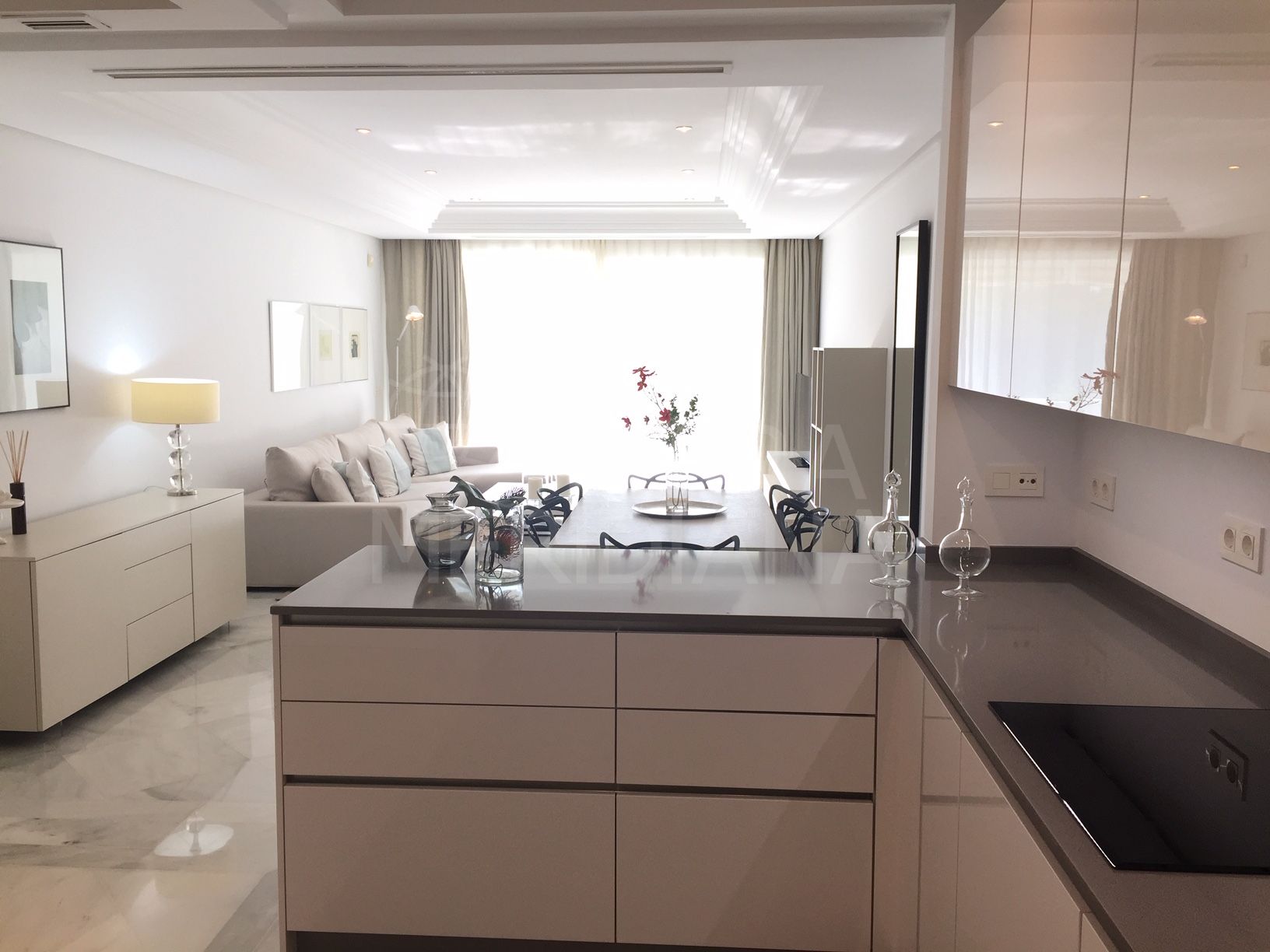 Uber chic luxury apartment with unobstructed sea views for sale in the exclusive beachfront development of Marina Mariola, Marbella Golden Mile