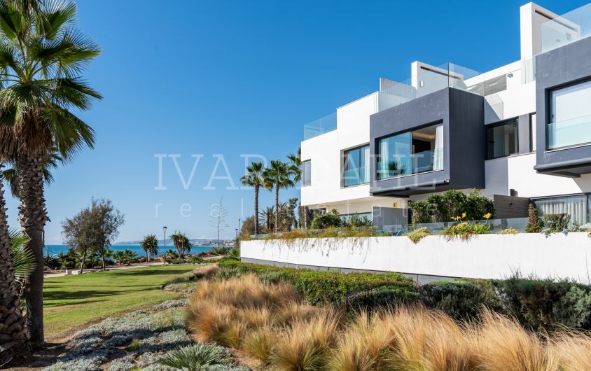 Key in hand Front Line Beach Townhouse in The Island for sale in Estepona, Costa del Sol