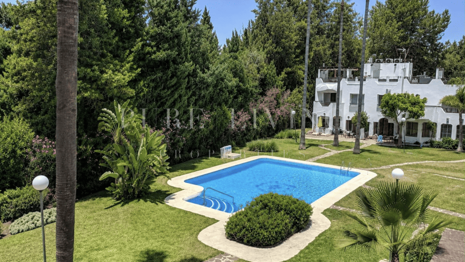 Refined golf-front townhouse with bright interiors & private solarium in prime Soleuropa, Nueva Andalucia