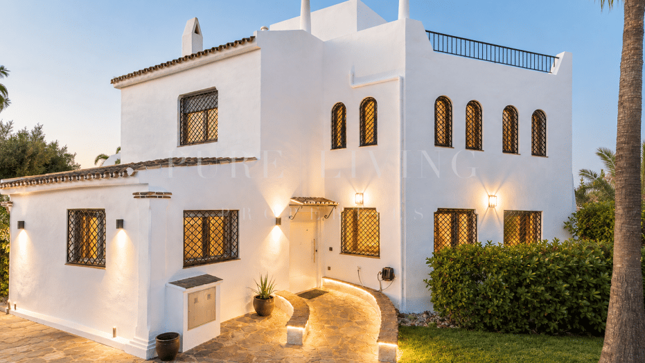 Refined golf-front townhouse with bright interiors & private solarium in prime Soleuropa, Nueva Andalucia