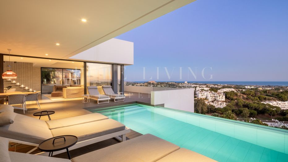 A breathtaking modern villa situated within the prestigious gated community of El Herrojo Alto