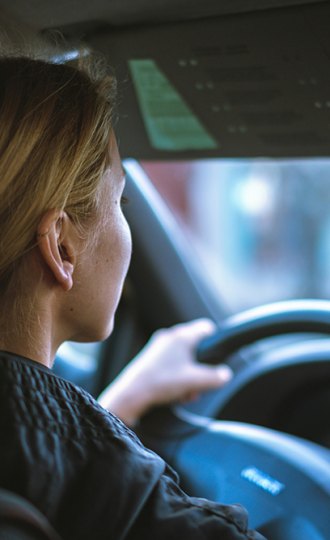 a woman driving, featured image for the article 