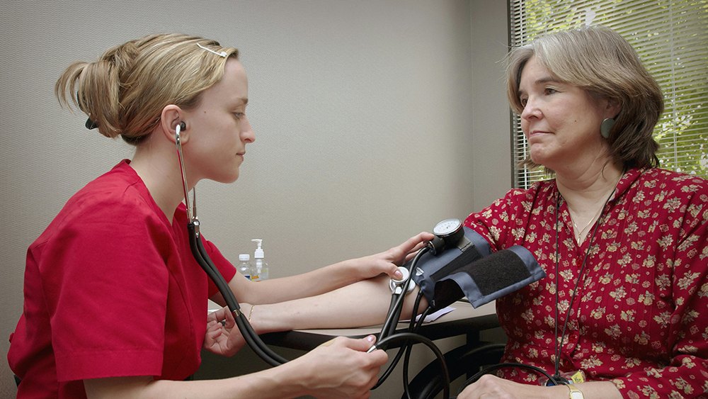 a health professional and a patient, featured image for the article