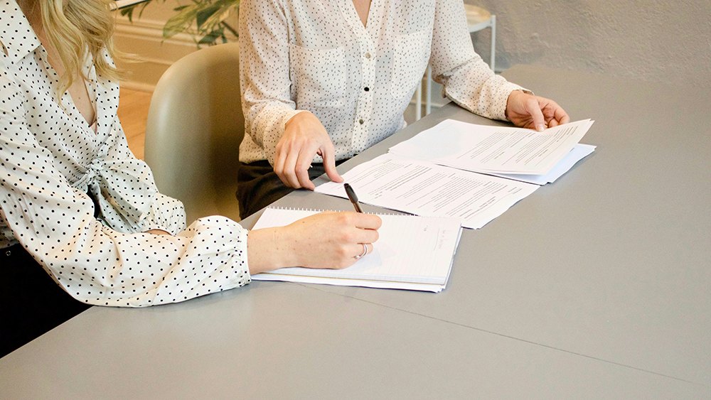 closup image of a couple of women going over property documents, featured image for the article