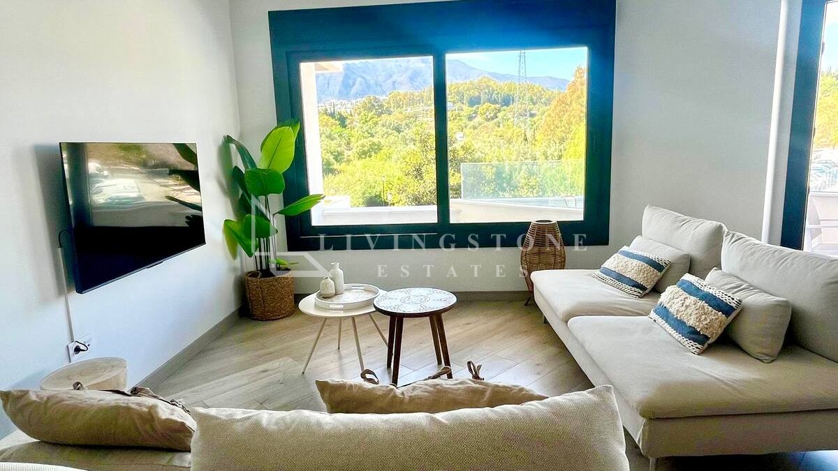 Contemporary Three-Bedroom Apartment in Estepona Town with Mountain Views