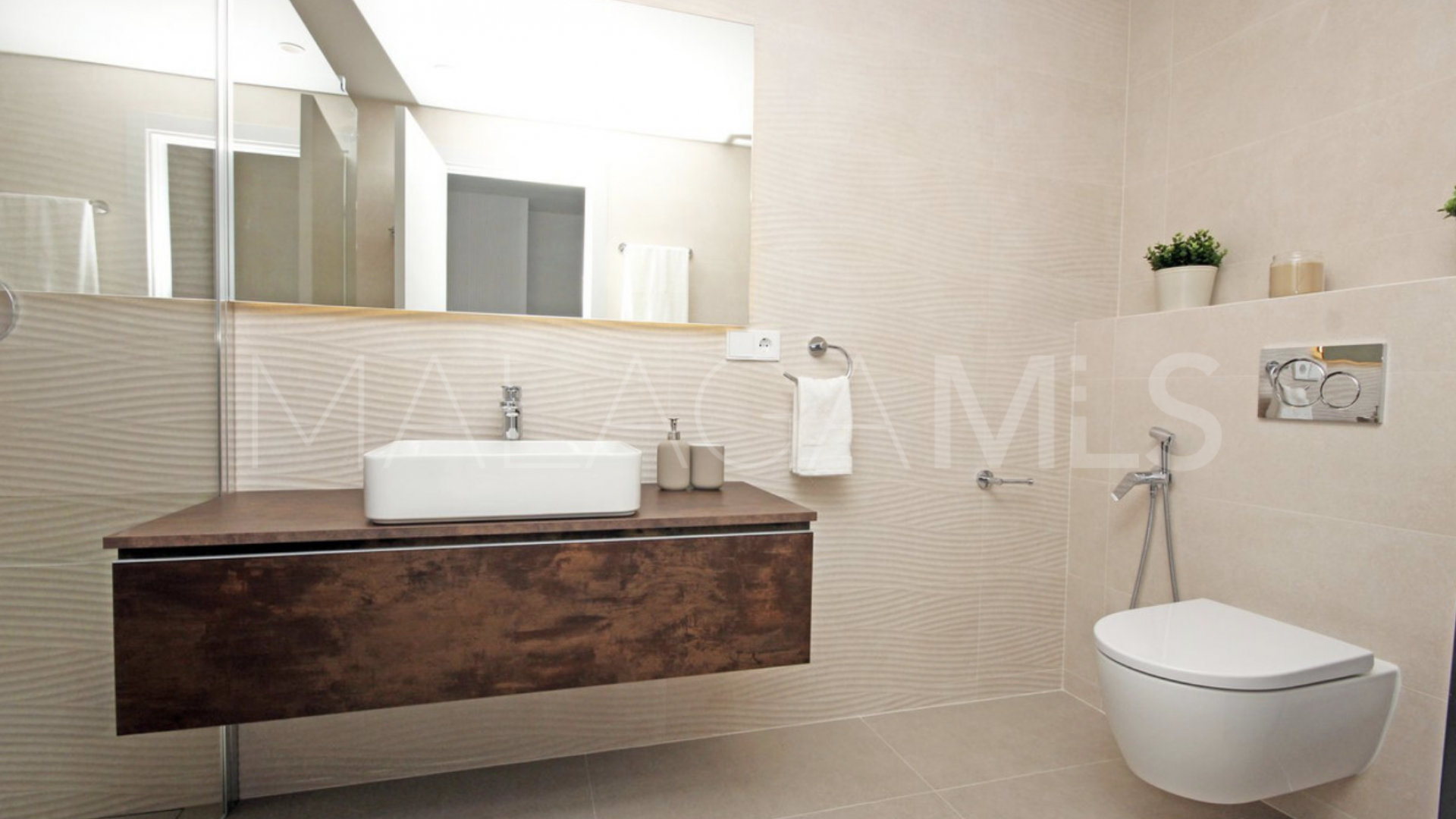 Buy Nueva Andalucia ground floor apartment