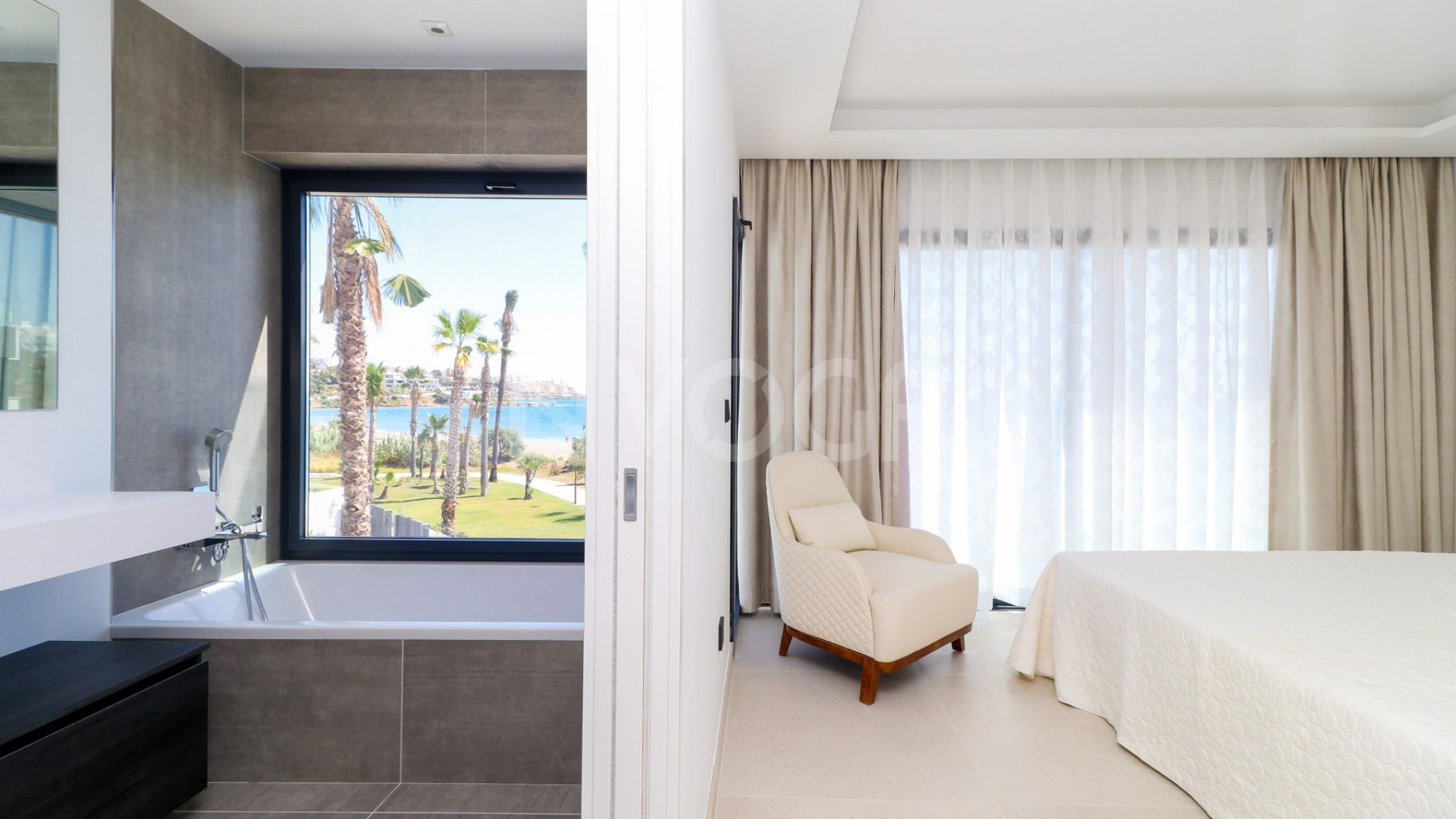 Gorgeous 3 bedroom beachfront townhouse in Estepona, with panoramic sea views.