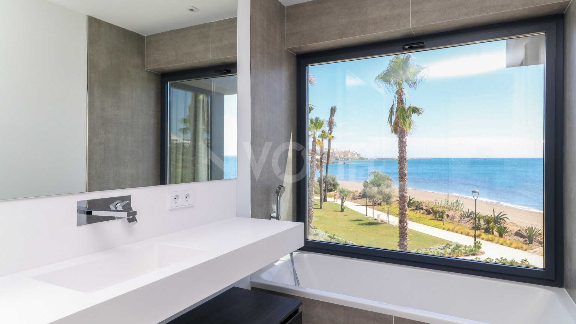 Gorgeous 3 bedroom beachfront townhouse in Estepona, with panoramic sea views.