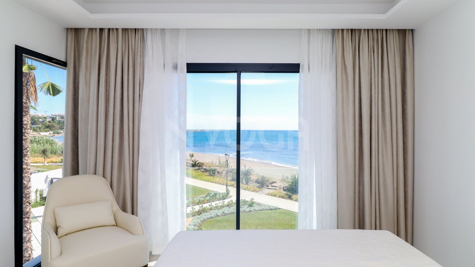 Gorgeous 3 bedroom beachfront townhouse in Estepona, with panoramic sea views.