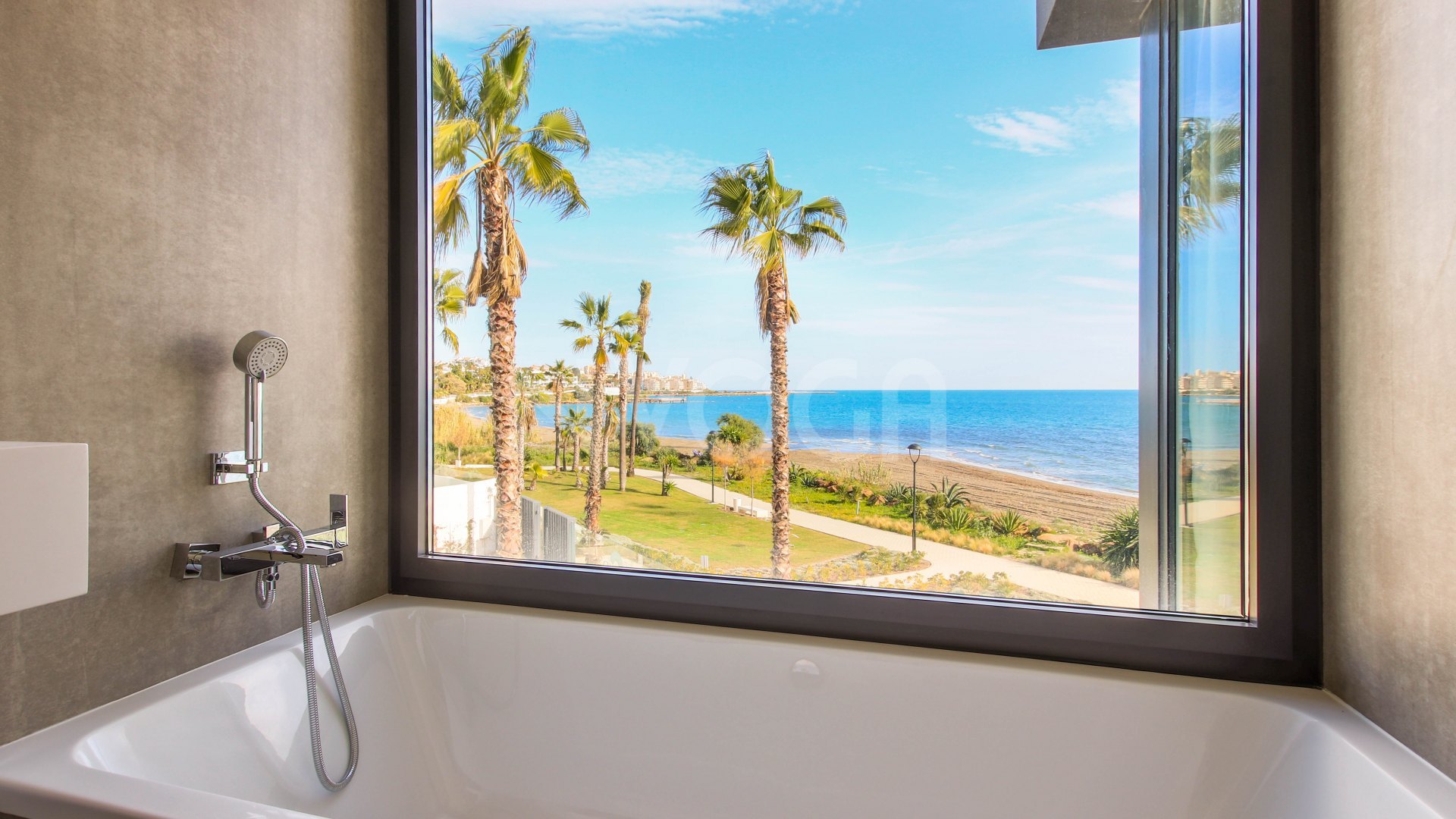 Gorgeous 3 bedroom beachfront townhouse in Estepona, with panoramic sea views.