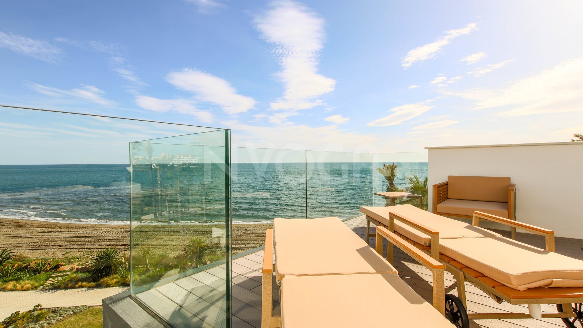 Gorgeous 3 bedroom beachfront townhouse in Estepona, with panoramic sea views.