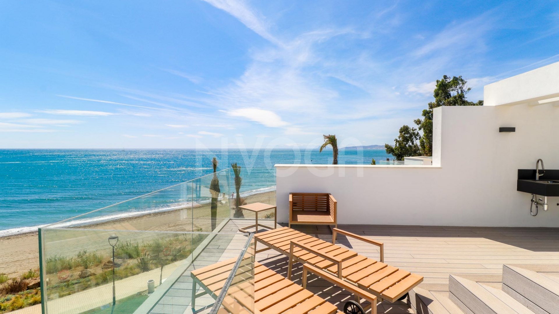 Gorgeous 3 bedroom beachfront townhouse in Estepona, with panoramic sea views.