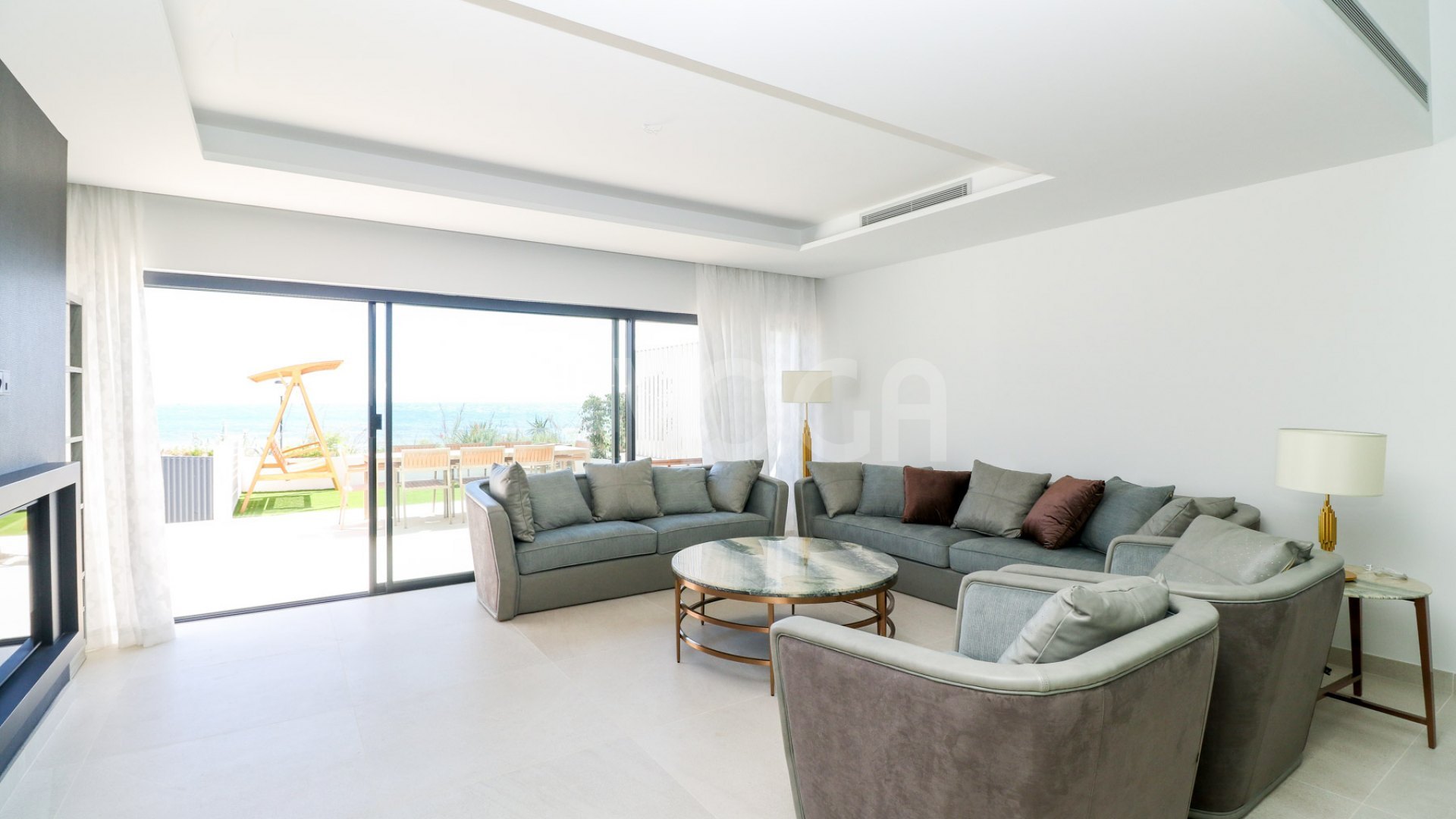 Gorgeous 3 bedroom beachfront townhouse in Estepona, with panoramic sea views.