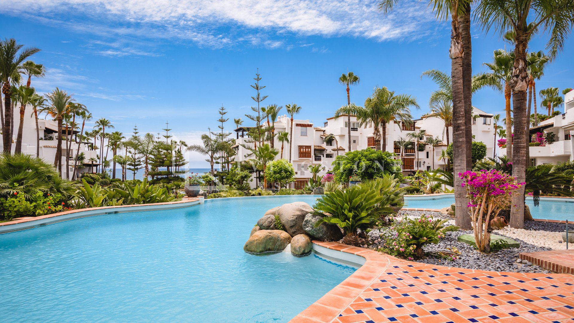 Fully renovated southwest-facing apartment in Japanese Gardens, Marina Puente Romano.