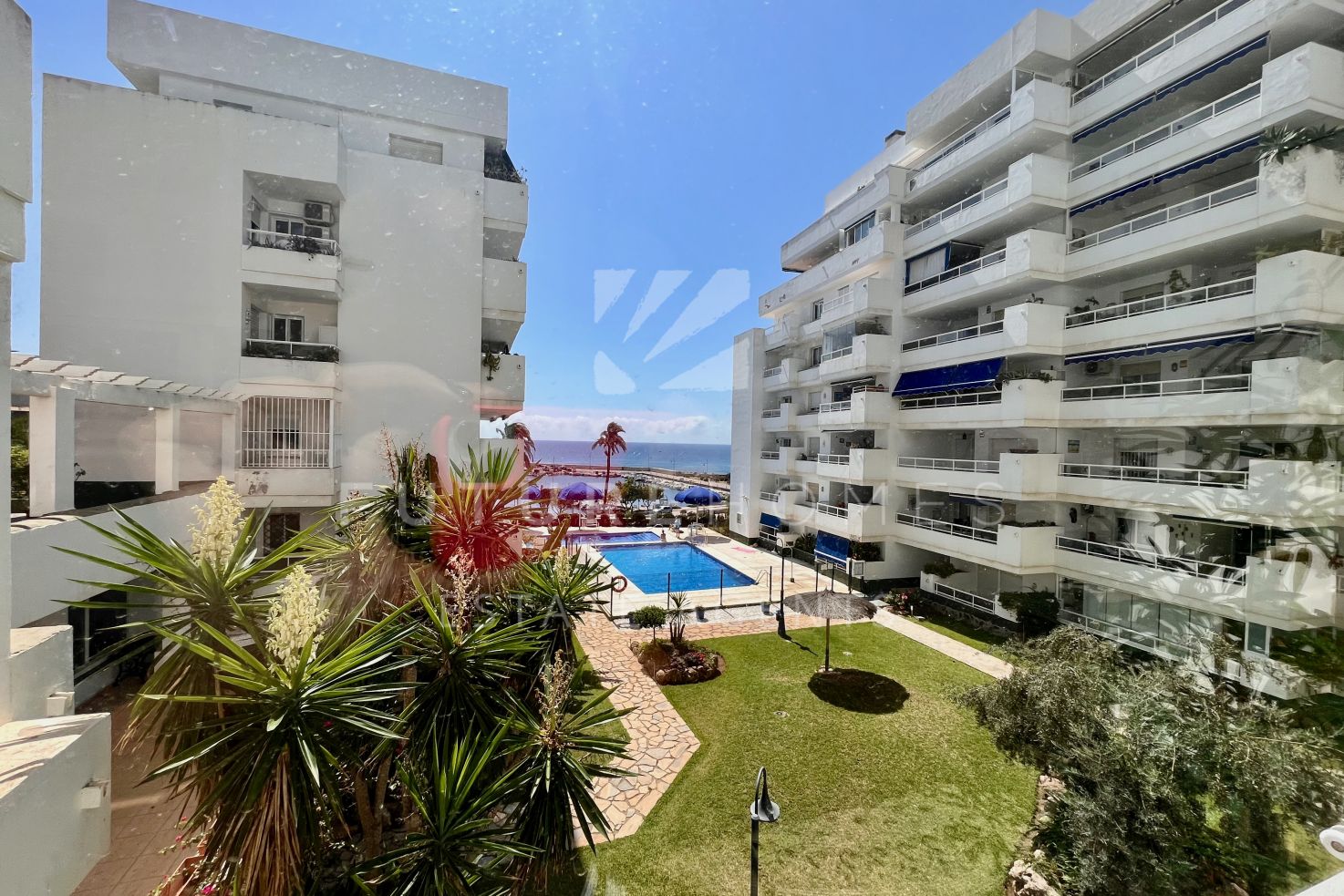 Immaculate apartment located next to Estepona port with private underground parking included.