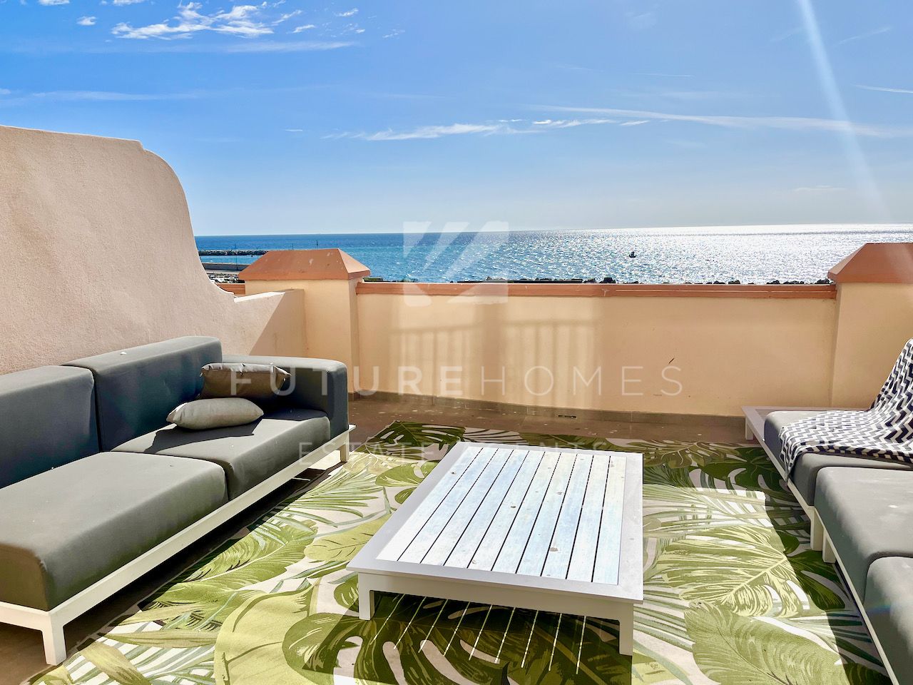 Stunning frontline beach townhouse for sale with high quality finishes and open sea views, in the heart of Estepona marina