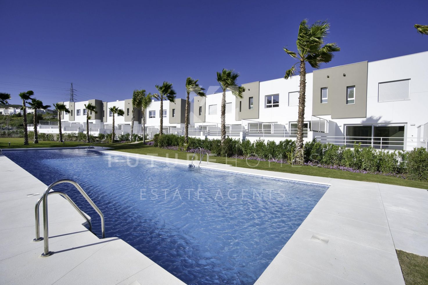 Modern townhouses for an amazing value on front line golf community just ten minutes from Estepona!