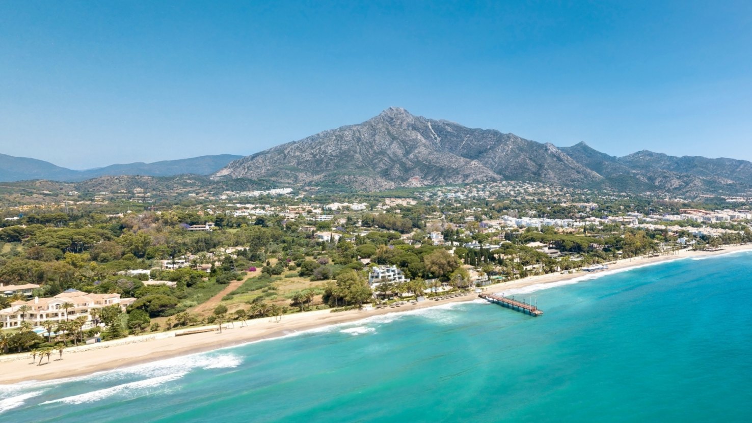 Image of Marbella from the sky, showcasing the stunning coastline and surrounding mountains.