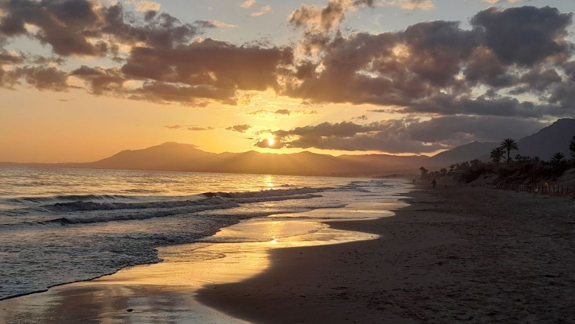 Sunset at Elviria beach with a mountain backdrop