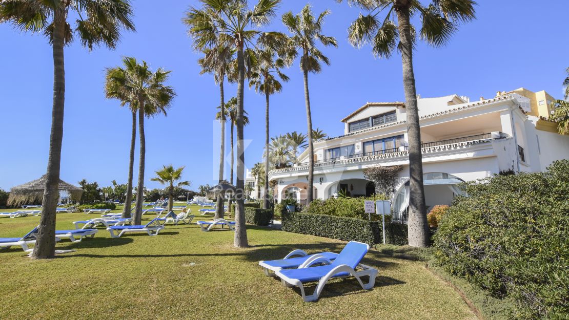 Frontline beach duplex ground floor apartment for sale in Cabopino, Marbella