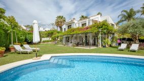 A beautiful traditional Andalusian style villa situated in the remarkable gated community Parcelas del Golf with 24hr security and a tennis club. As you approach, the villas allure unfolds, with its mature garden lending an air of romance and tranquility