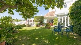 This lovely spacious 3-bedroom corner townhouse is located in one of the most sought-after gated communities in Nueva Andalucia adjacent to Las Brisas Golf Course and is within walking distance to both restaurants and shops; thus a perfect family home, wi