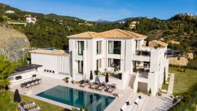 A striking trophy residence with scenic views for sale in the affluent private community of El Madroñal, Benahavis