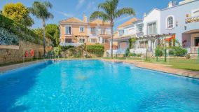 South-facing three bedroom corner townhouse with potential in Nueva Andalucia Marbella