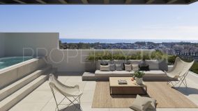 Villa pareada a estrenar con vistas al mar junto a campos de golf en Marbella Oeste