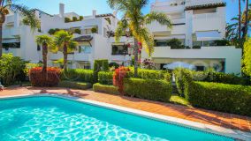 Apartamento en lado playa con jardin privado en la Milla de Oro..