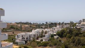 Three-bedroom duplex penthouse offering sea views & featuring a private 200 m² garden and an exceptionally large storage room, offers a unique living experience in a gated Andalusian-style complex