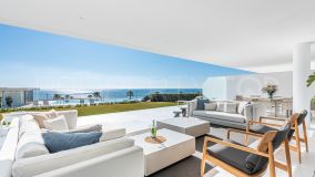 Stylish beachfront duplex apartment on the garden level with large terrace and frontal sea views