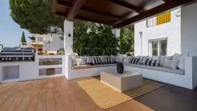 Refurbished apartment with a huge terrace located in peaceful and quiet surroundings in the hills of Benahavis!