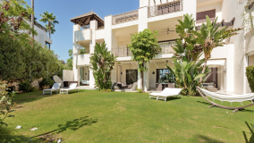 Magnificent luxury garden apartment with five bedrooms and stunning sea views, situated in Mirador del Paraíso, Benahavís