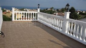 Lovely semi-detached house for sale that has been divided into two apartments, near the beach of El Faro in Mijas.