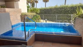 A frontline beach apartment for sale in Estepona with private pool