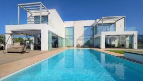 For sale this contemporary villa, with panoramic sea views, next to Alqueria Golf