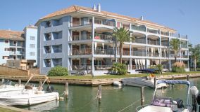 A spacious luxury ground floor apartment on an island with views over the famous Sotogrande Marina