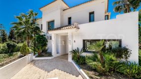 Exceptional villa boasting sea views, situated within a gated community in Lomas de Magna on the prestigious Golden Mile
