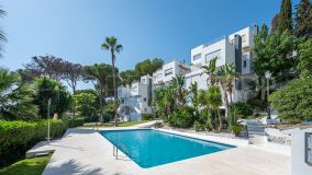 Contemporary style townhouse in Nueva Andalucia with three bedrooms and panoramic sea and mountain views.