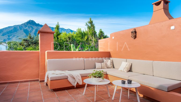 Elegant renovated modern luxury townhouse in prestigious Altos de Puente Romano, Marbella's Golden Mile