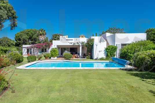 Charming soulful single storey villa on and beautiful south facing plot bordering Guadalquinton.