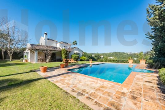 Lovely south-facing 3 storey family villa located in a mature area of Sotogrande Alto with views to the sea and La Reserva Golf Course