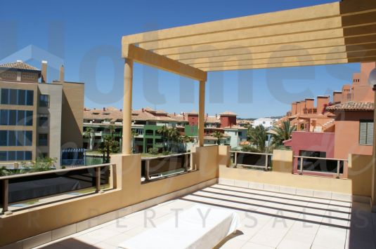 A furnished penthouse apartment in the Marina with a very sunny aspect and pleasant views.