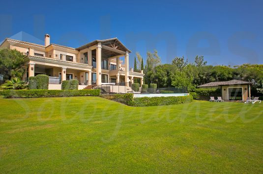 A stunning villa with majestic views over 3 golf courses to the sea and the mountains.