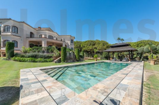 A superb villa built on an elevated site with outstanding panoramic views over golf courses to mountains and the sea.