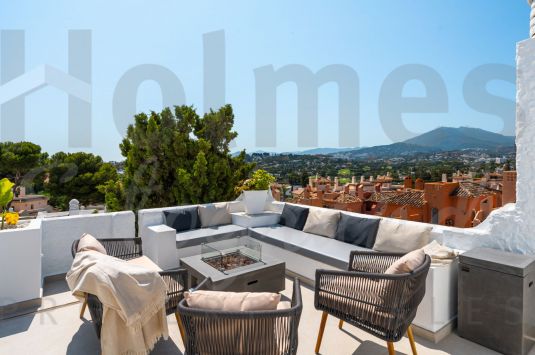 Duplex penthouse in Nueva Andalucía designed to balance comfort with extensive outdoor living.