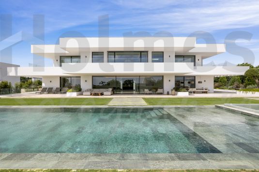This exquisite villa is an architectural showpiece of luxurious modern contemporary elegance.