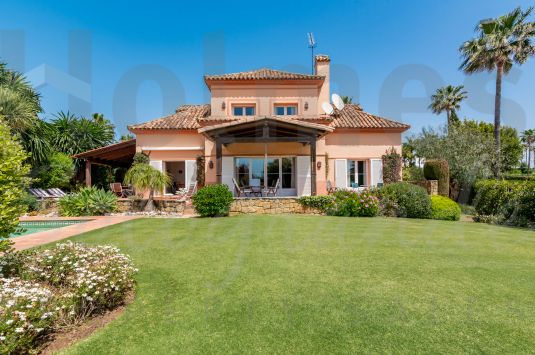 Traditional style south-facing villa with golf and sea views.